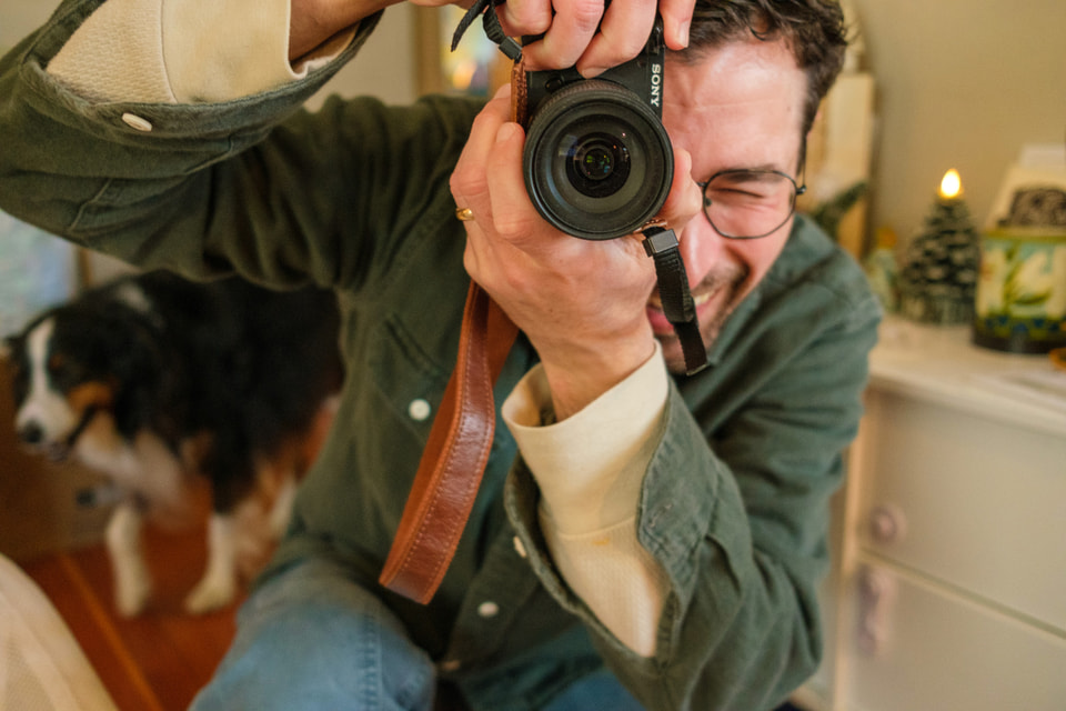 Michael Mishali photographing on the coast